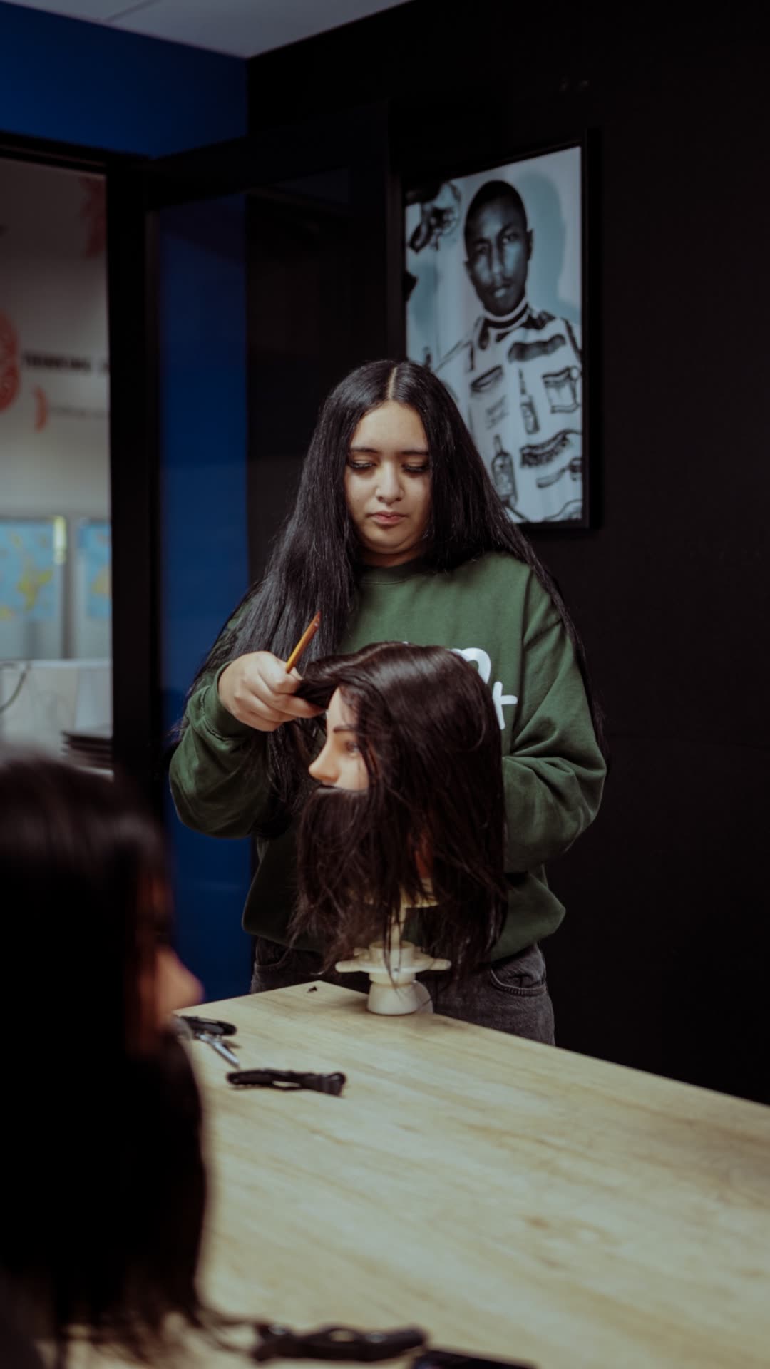A young woman practising sectioning on a mannequin